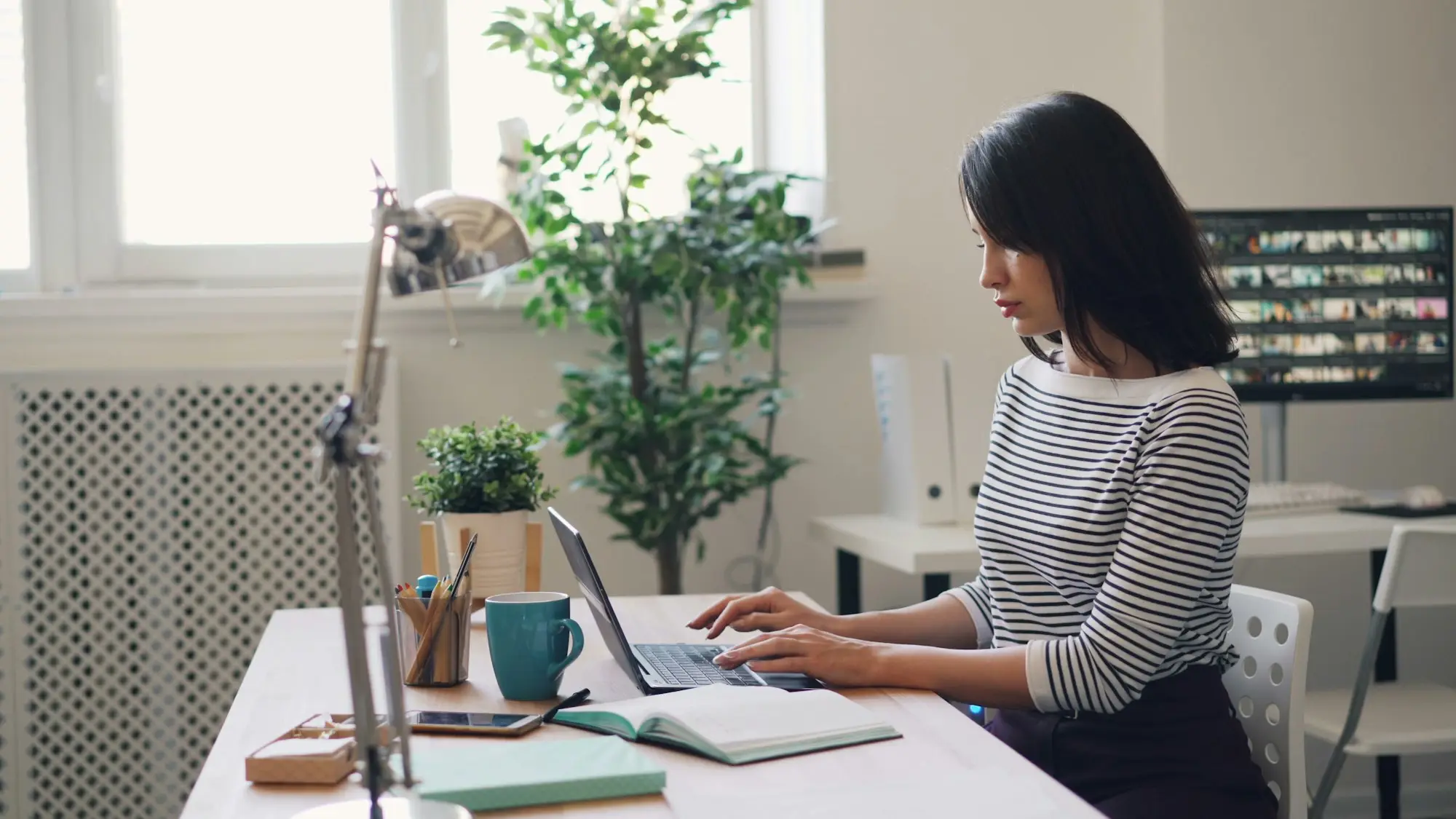 Accountant working through tax deductions at her desk