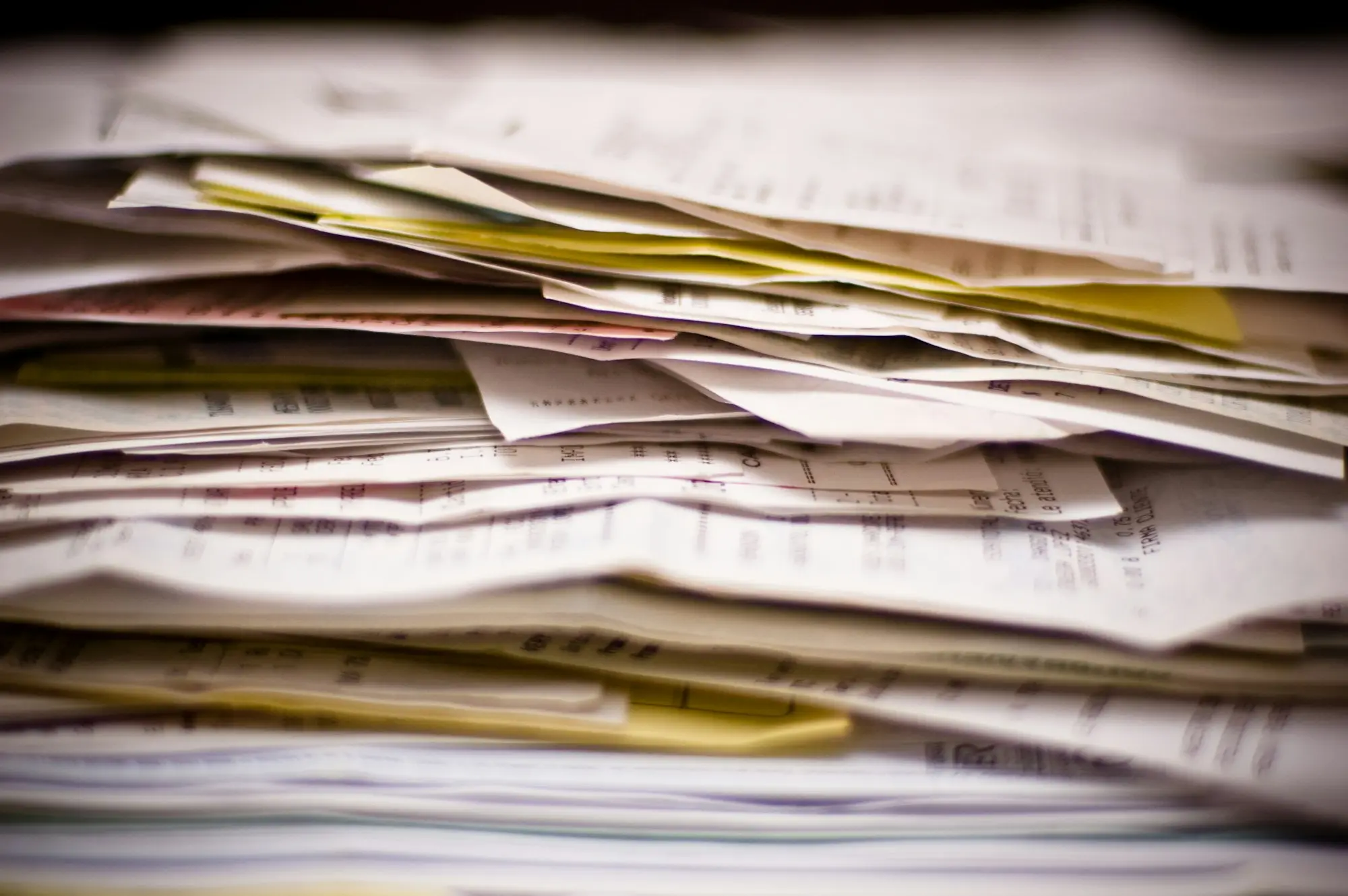 Stack of paperwork and files for a small business